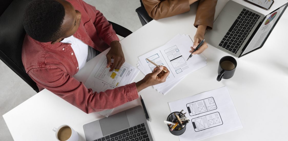 top-view-people-working-with-laptops